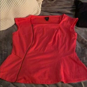 Woman’s dress shirt with a curved zip up front.